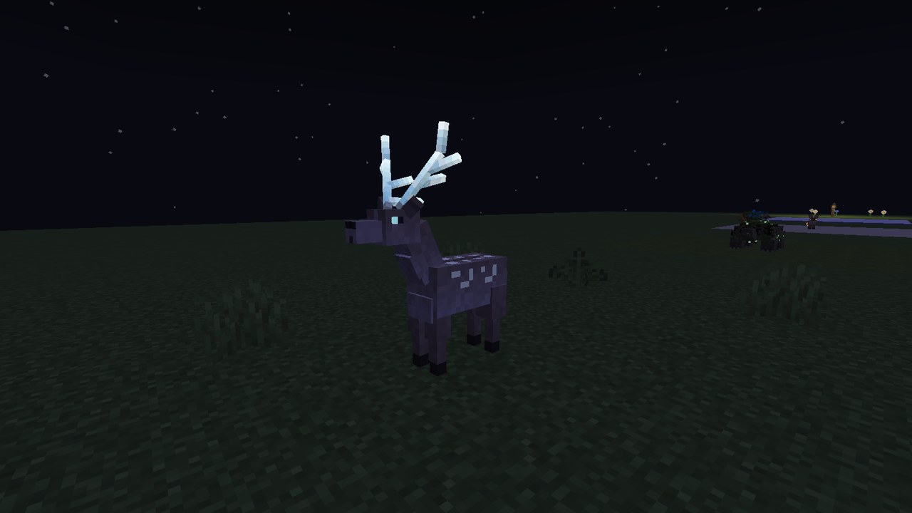 A pale spotted stag with tall branching crystal antlers glowing white in the dark